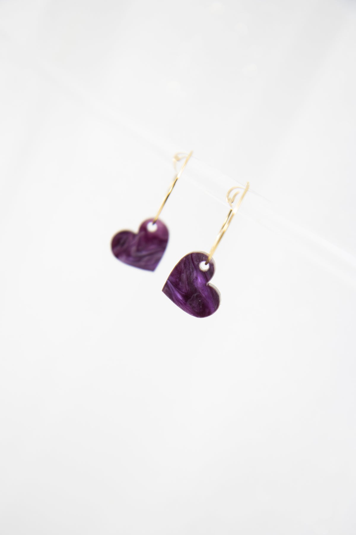 Filigree hoop earrings with heart pendant made of acrylic