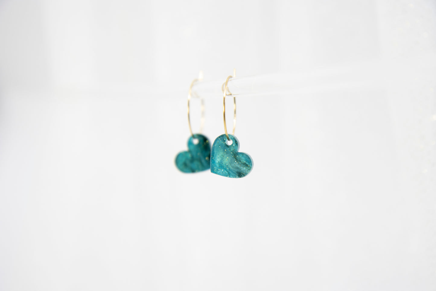 Filigree hoop earrings with heart pendant made of acrylic
