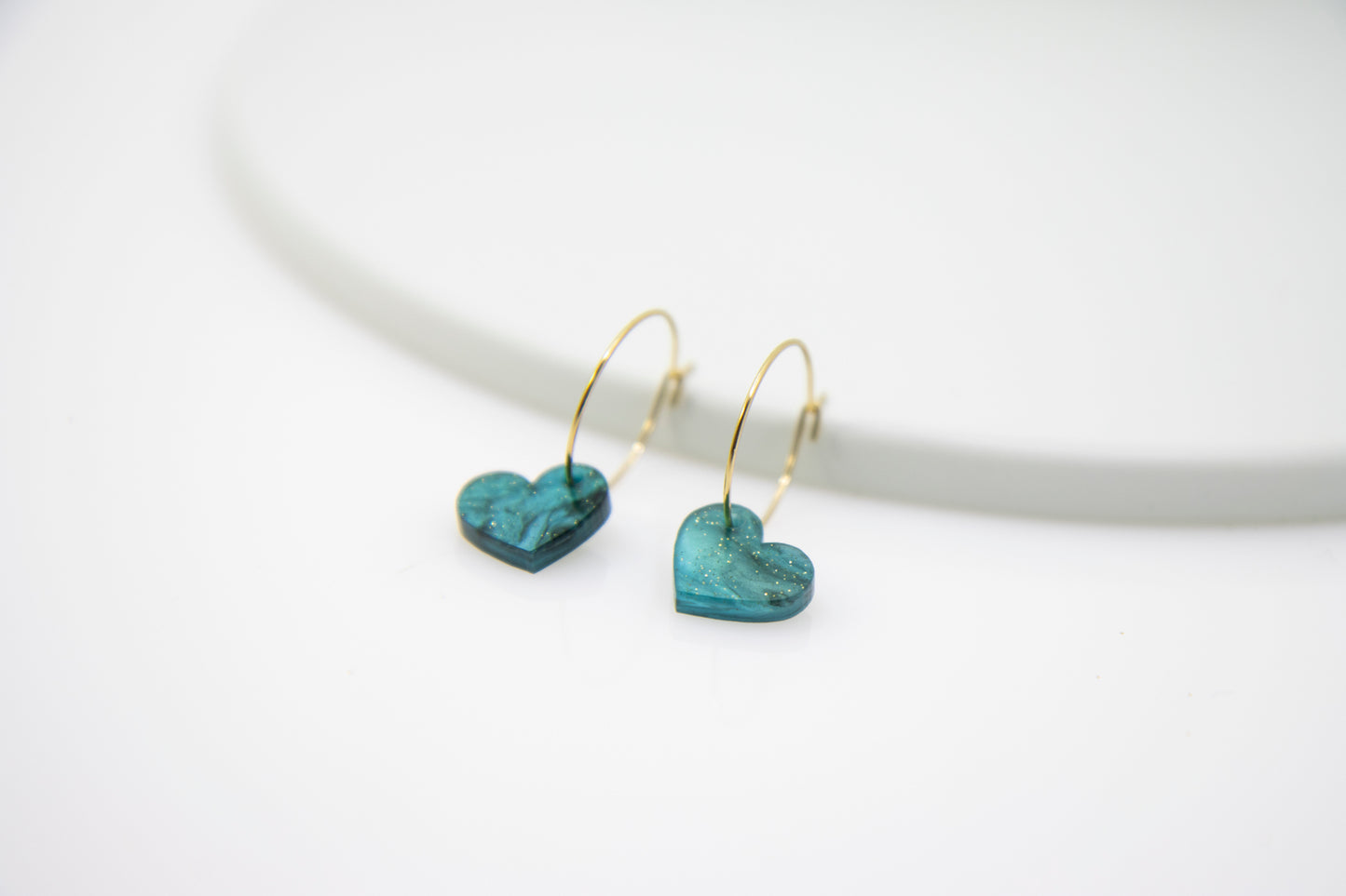 Filigree hoop earrings with heart pendant made of acrylic