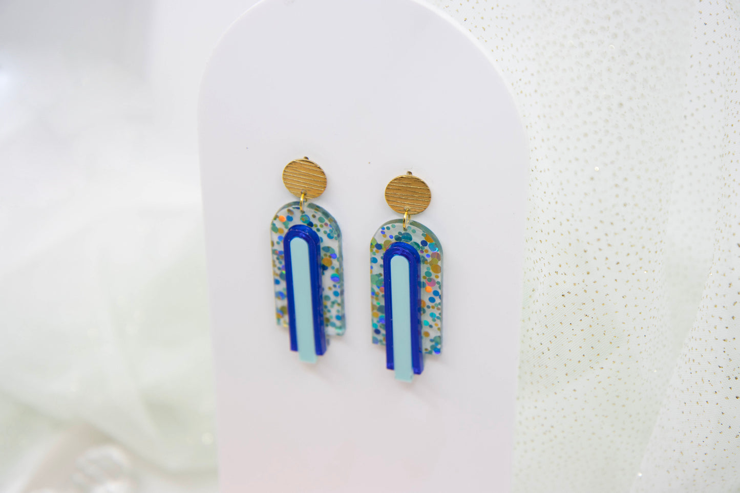 Geometric arch statement earrings "GINA" – glitter blue