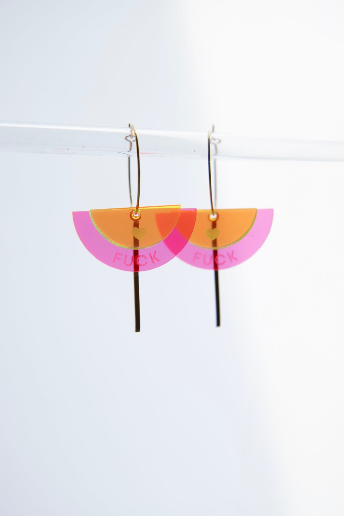 Gold-colored "FUCK" neon acrylic hoop earrings