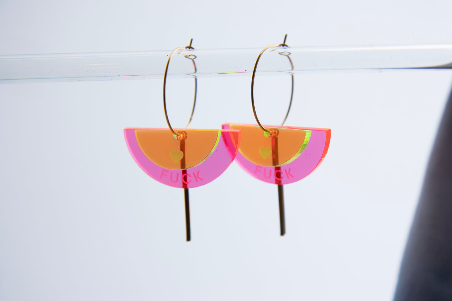 Gold-colored "FUCK" neon acrylic hoop earrings