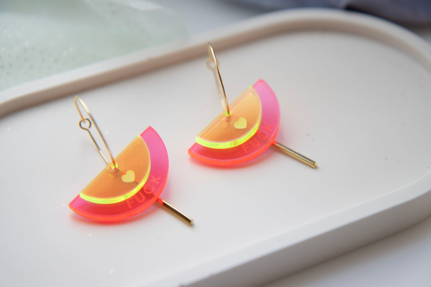 Gold-colored "FUCK" neon acrylic hoop earrings