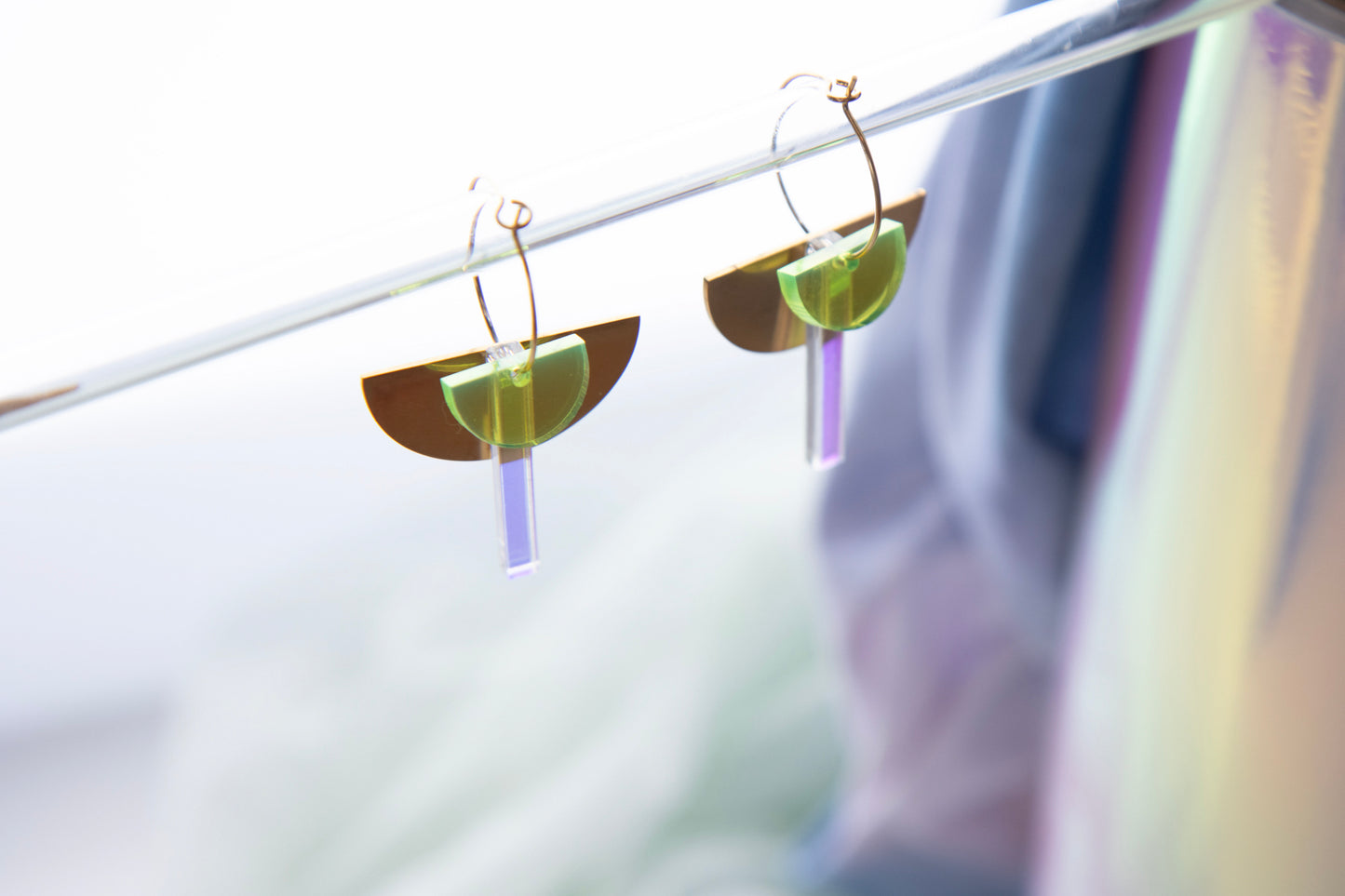 Geometric hoop earrings made of recycled neon acrylic iridescent