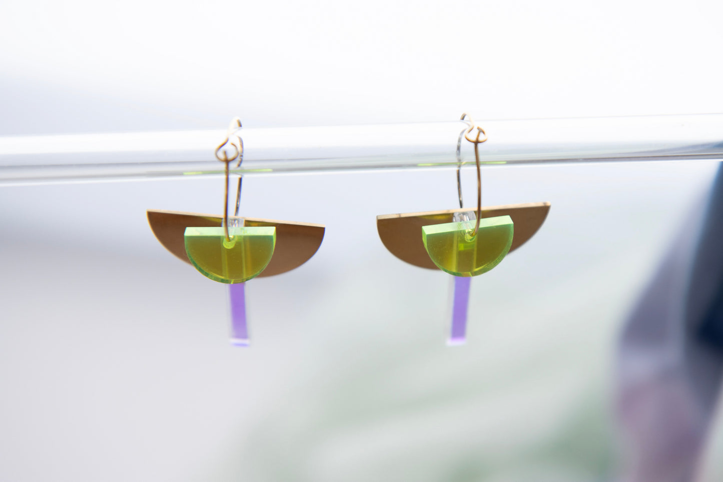 Geometric hoop earrings made of recycled neon acrylic iridescent