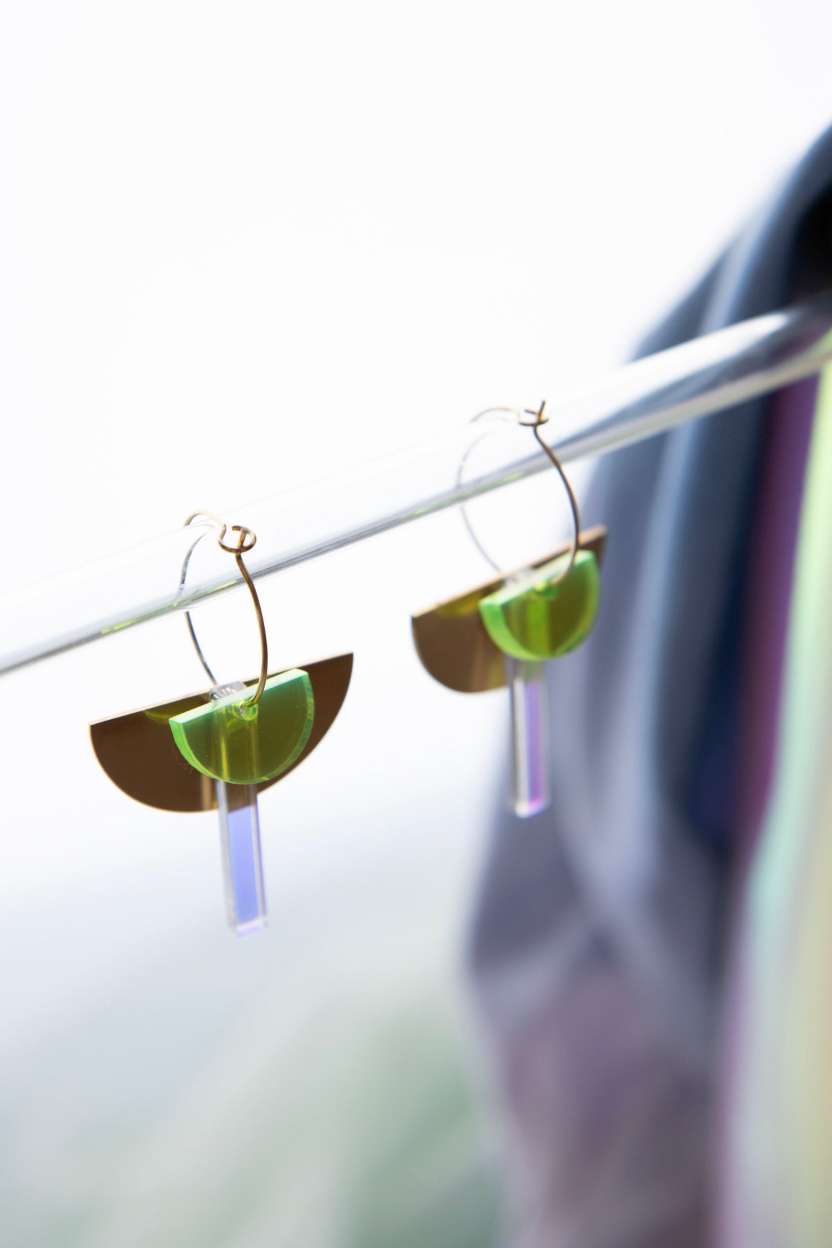 Geometric hoop earrings made of recycled neon acrylic iridescent