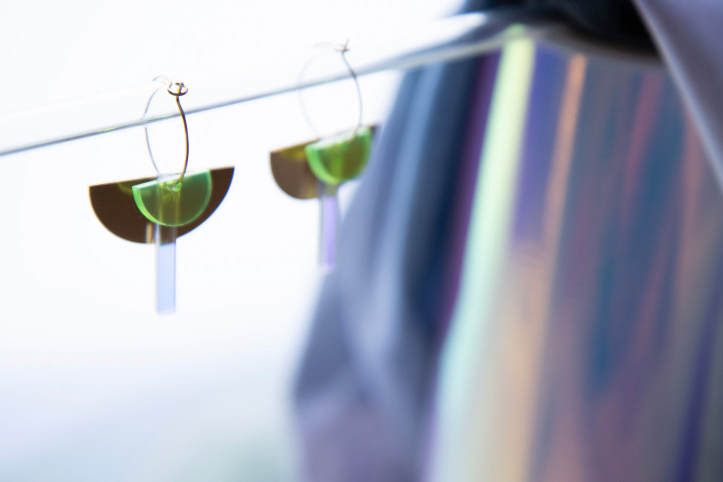 Geometric hoop earrings made of recycled neon acrylic iridescent