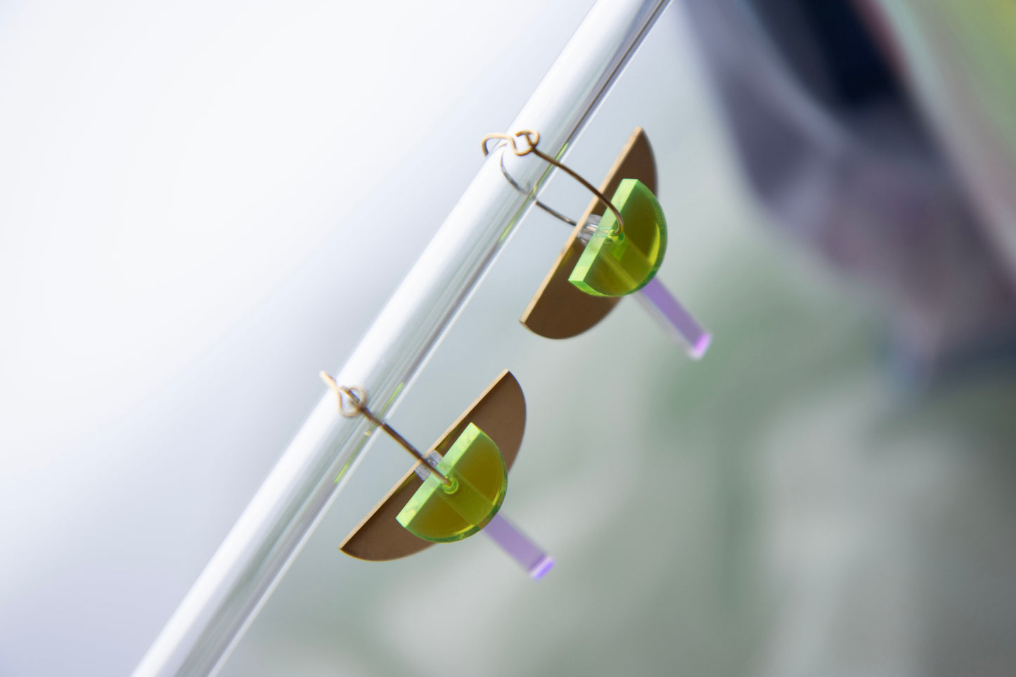 Geometric hoop earrings made of recycled neon acrylic iridescent