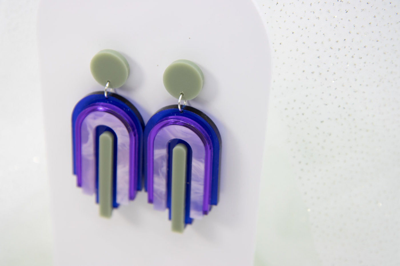 bow statement earrings – blue transparent & mirror purple laser jewelry