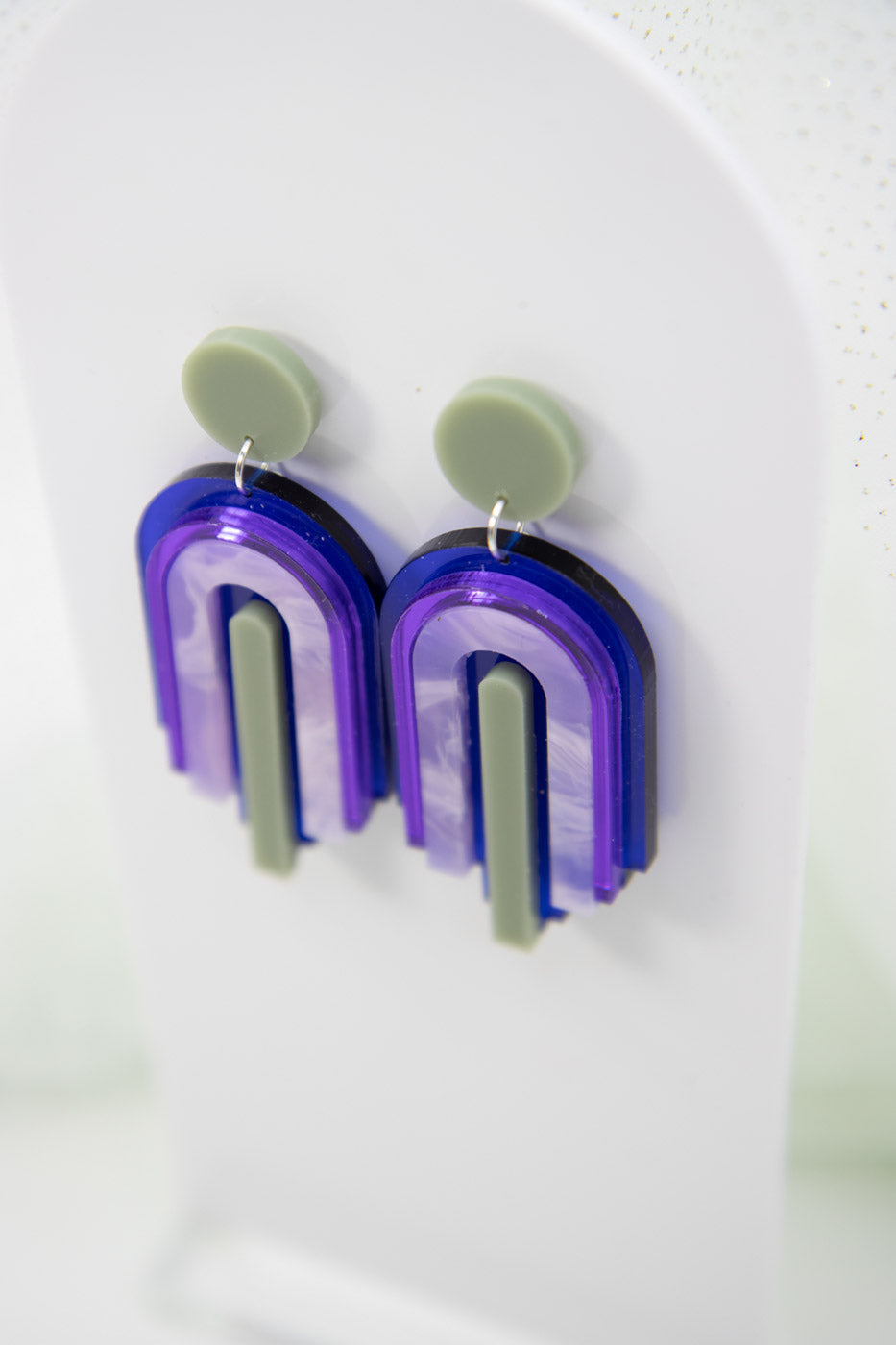 bow statement earrings – blue transparent & mirror purple laser jewelry
