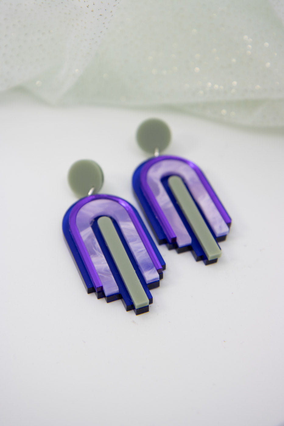 bow statement earrings – blue transparent & mirror purple laser jewelry